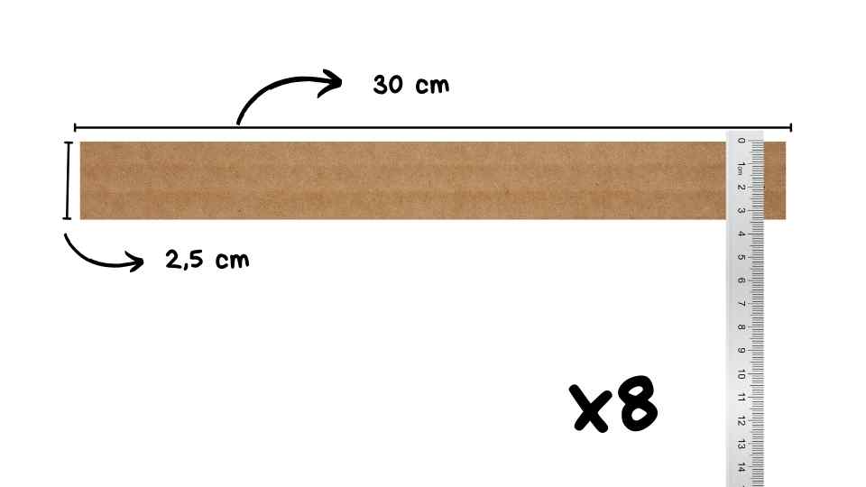 Tira de cartón de 30 cm de largo y 2,5 cm de ancho, con una regla a la derecha para medir y una anotación que indica que hay 8 unidades.